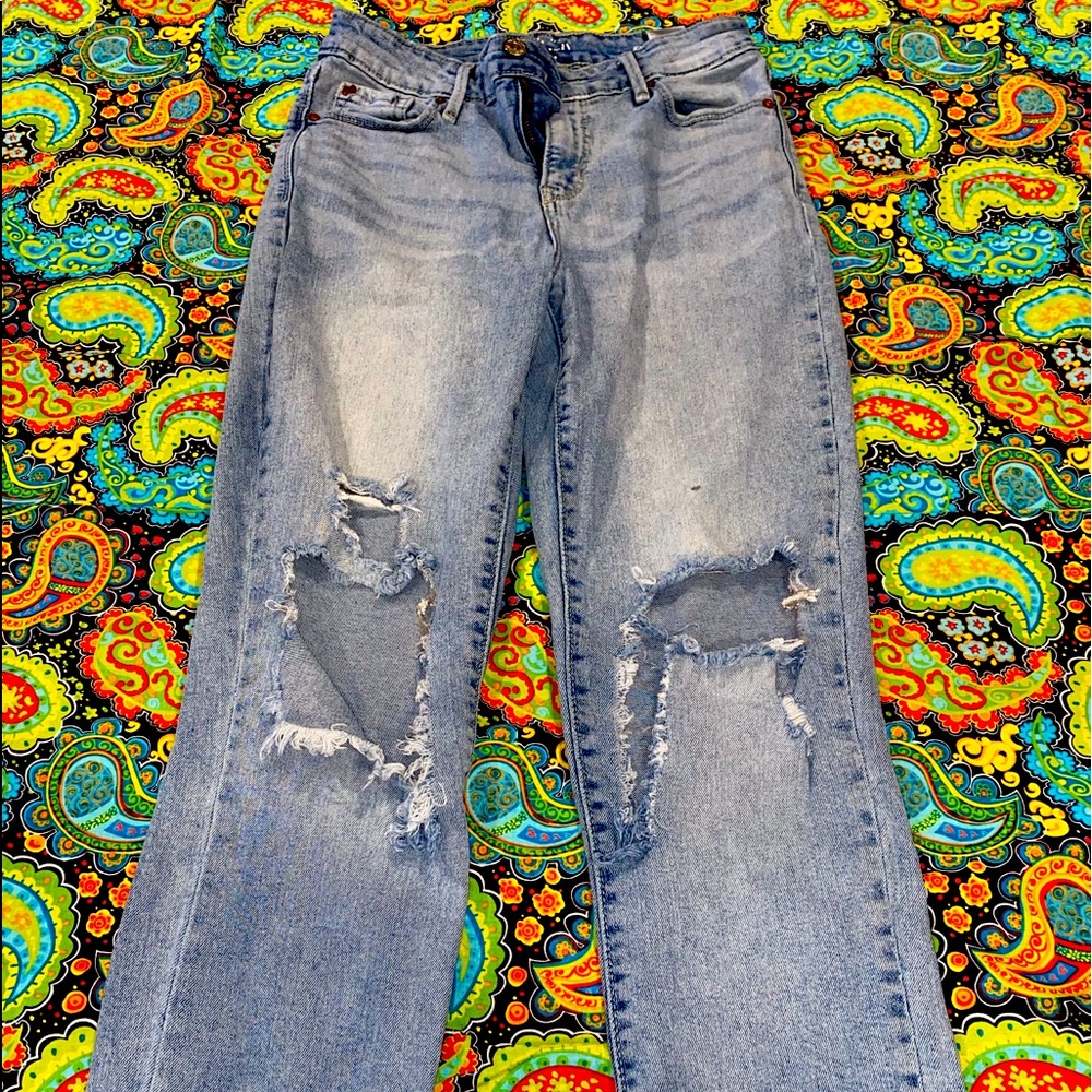 Light wash jean short with ripping in knees